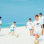 Kids playing football at Four Seasons Maldives