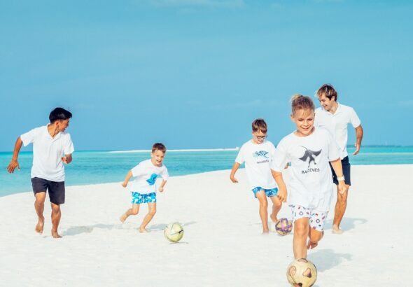 Kids playing football at Four Seasons Maldives