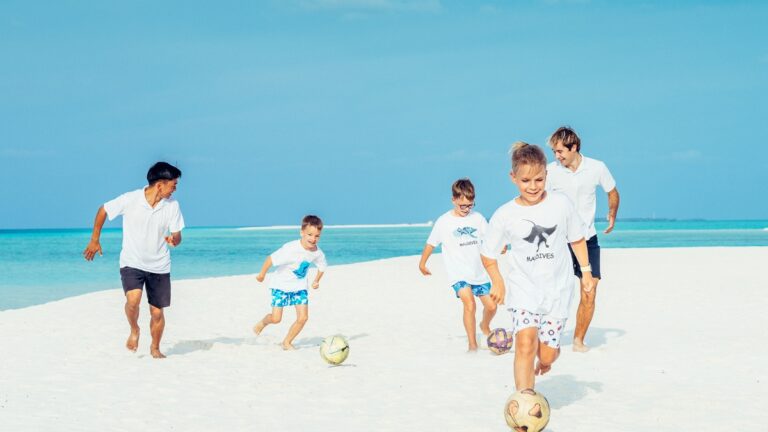 Kids playing football at Four Seasons Maldives
